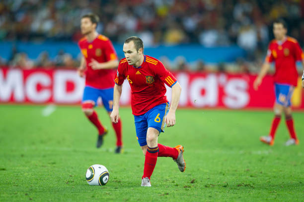 Andrés Iniesta in a red #6 jersey
